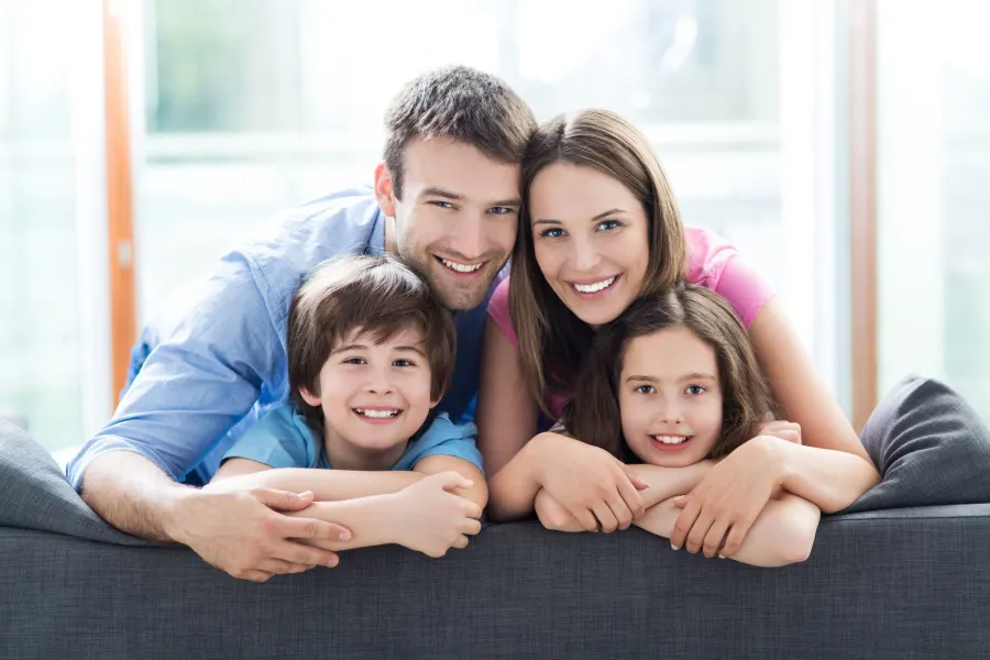 A smiling family of four